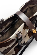 Load image into Gallery viewer, Brown and beige patterned handbag with a gold clasp on a light gray background
