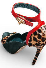 Load image into Gallery viewer, High-heeled shoe with leopard print and red strap on a white background
