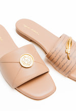 Load image into Gallery viewer, Pair of beige slides with gold accents on a white background
