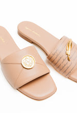 Load image into Gallery viewer, Pair of beige slides with gold accents on a white background
